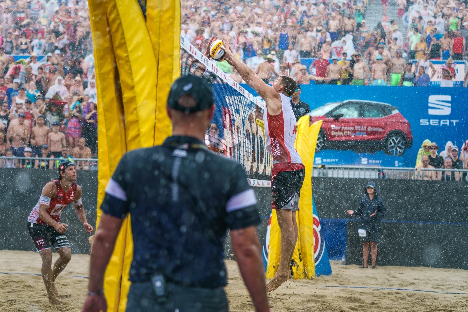 Action from the Red Bull Beach Arena as the rain comes down during the storm